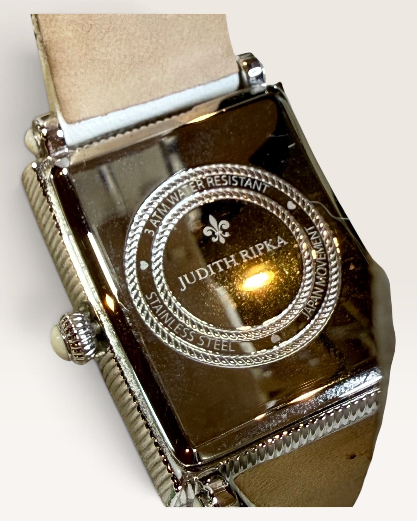 Judith Ripka Rectangular Cable-Edge Wristwatch Featuring a Textured Silver Dial with Stylized Oversized Arabic Numerals and a White Quilted Leather Strap