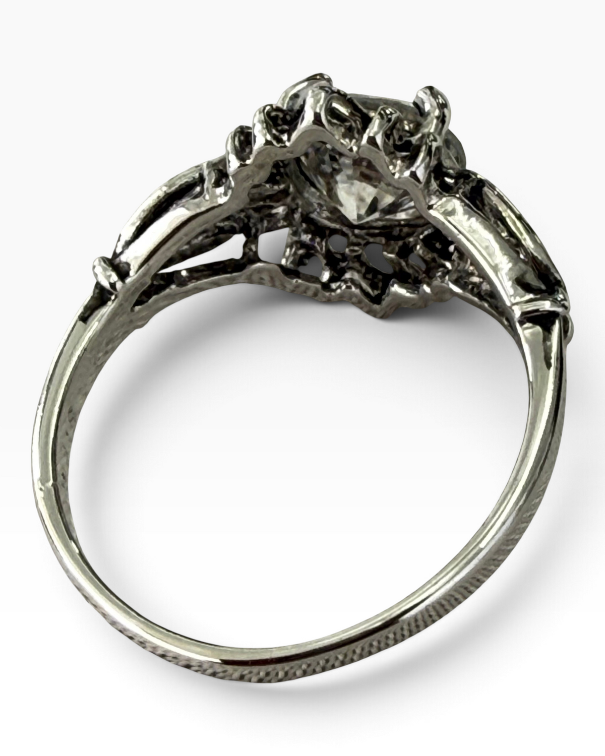 Cavallaro Creations sterling silver ring with intricate filigree setting and a round-cut clear stone.