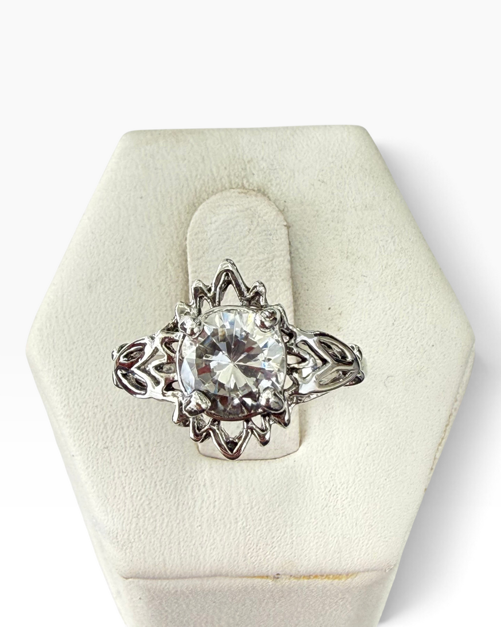 Cavallaro Creations sterling silver ring featuring a round-cut clear stone in an intricate vintage filigree setting.