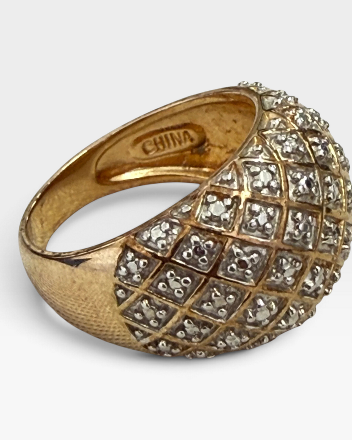 Cavallaro Creations gold dome ring featuring a quilted diamond lattice pattern with shimmering stone accents.