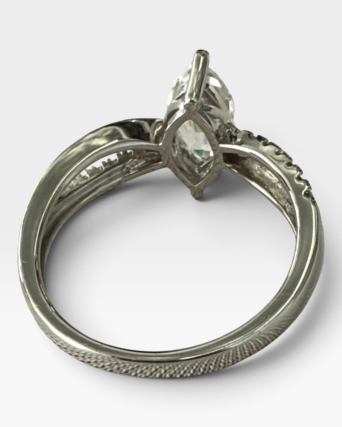 Cavallaro Creations sterling silver ring featuring a marquise-cut solitaire stone and pavé accented split shank band.