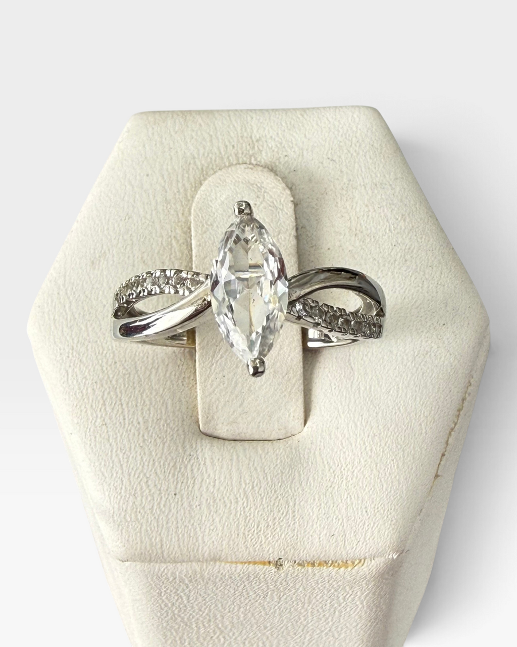 Cavallaro Creations marquise cut sterling silver solitaire ring with pavé accents on an intertwining split shank band.