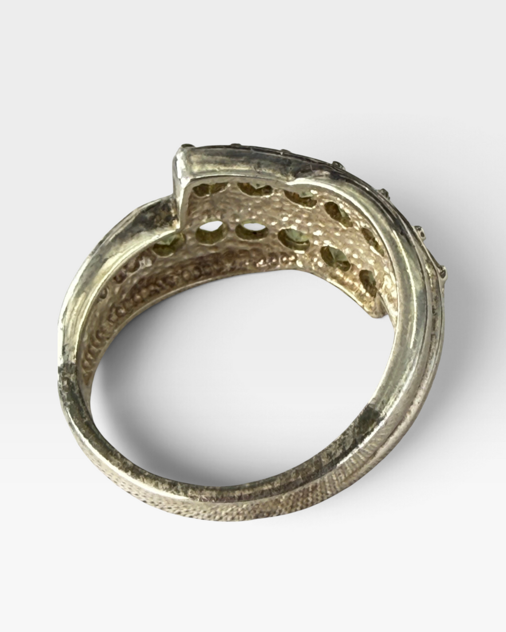 Cavallaro Creations sterling silver bypass ring featuring two rows of round-cut lime-green peridot gemstones.