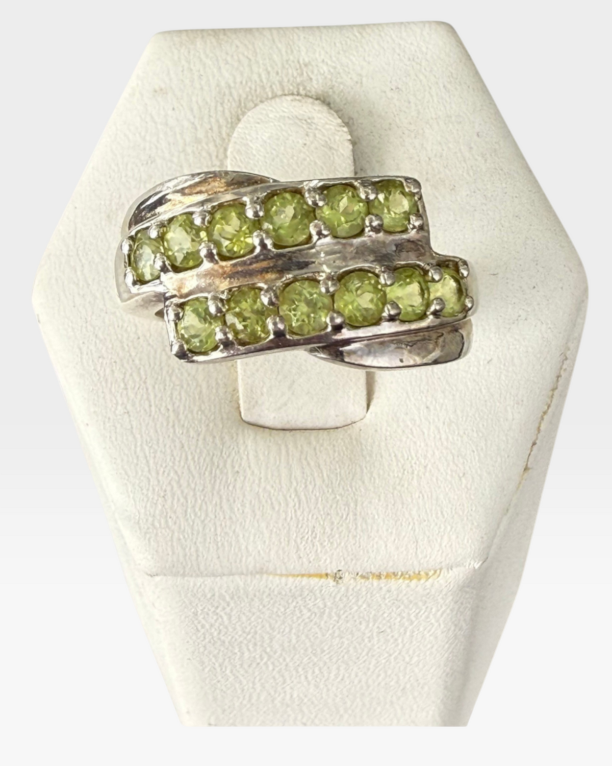 Cavallaro Creations sterling silver bypass ring featuring two rows of round-cut lime-green peridot gemstones.