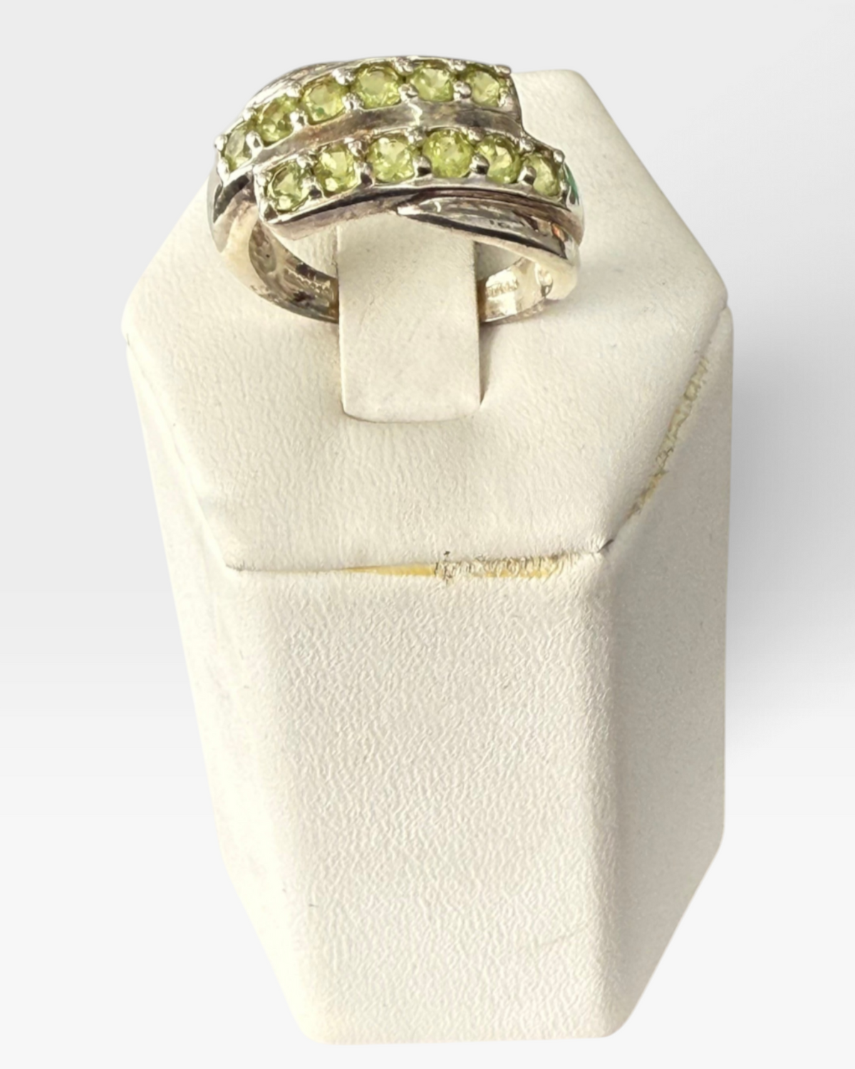 Cavallaro Creations sterling silver bypass ring featuring two rows of round-cut lime-green peridot gemstones.