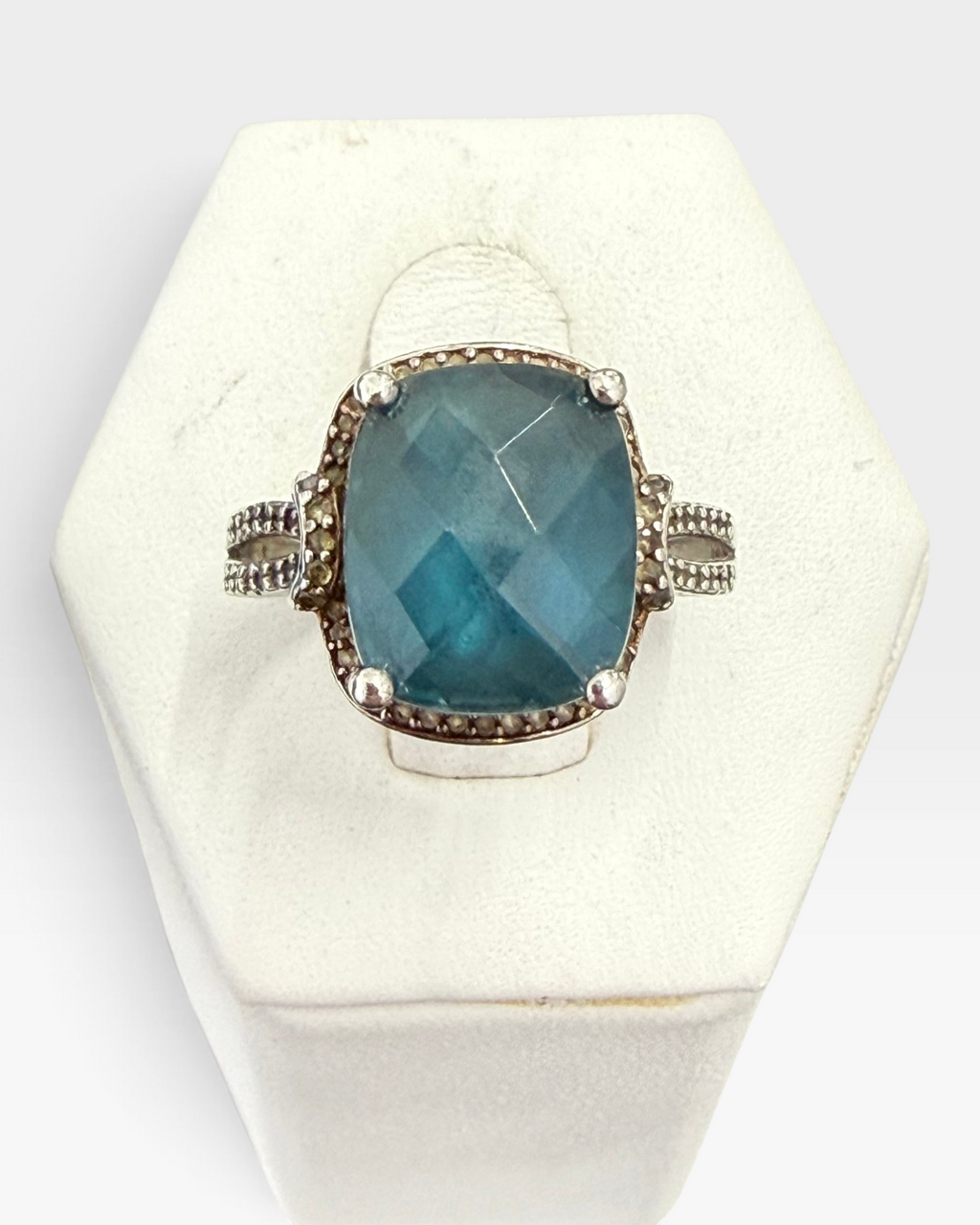 Cavallaro Creations sterling silver statement ring with a cushion-cut blue stone and intricate beaded band detailing.