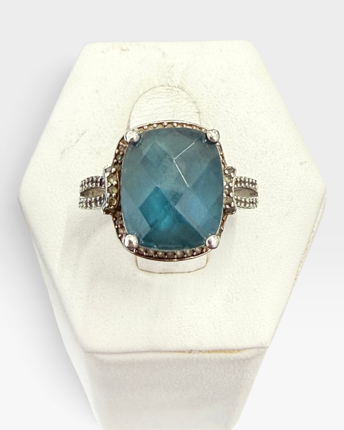 Cavallaro Creations sterling silver statement ring with a cushion-cut blue stone and intricate beaded band detailing.