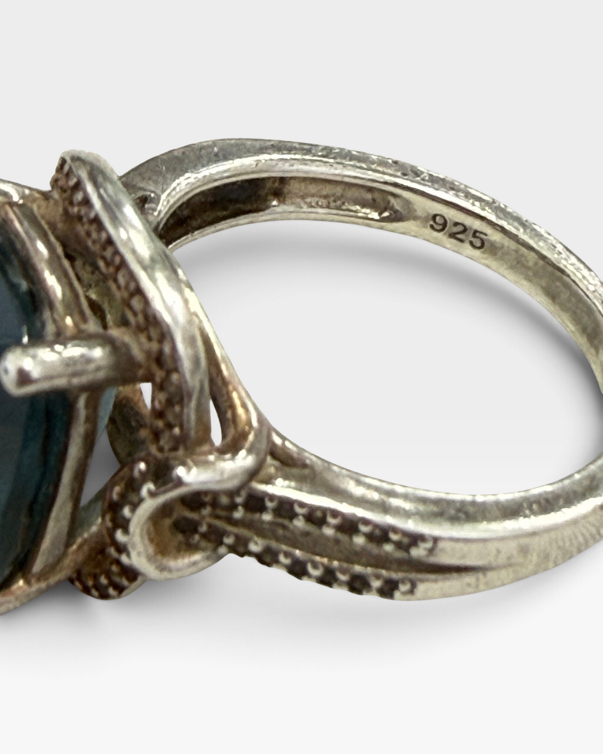 Cavallaro Creations sterling silver statement ring featuring a cushion-cut blue stone and intricate beaded band detail.