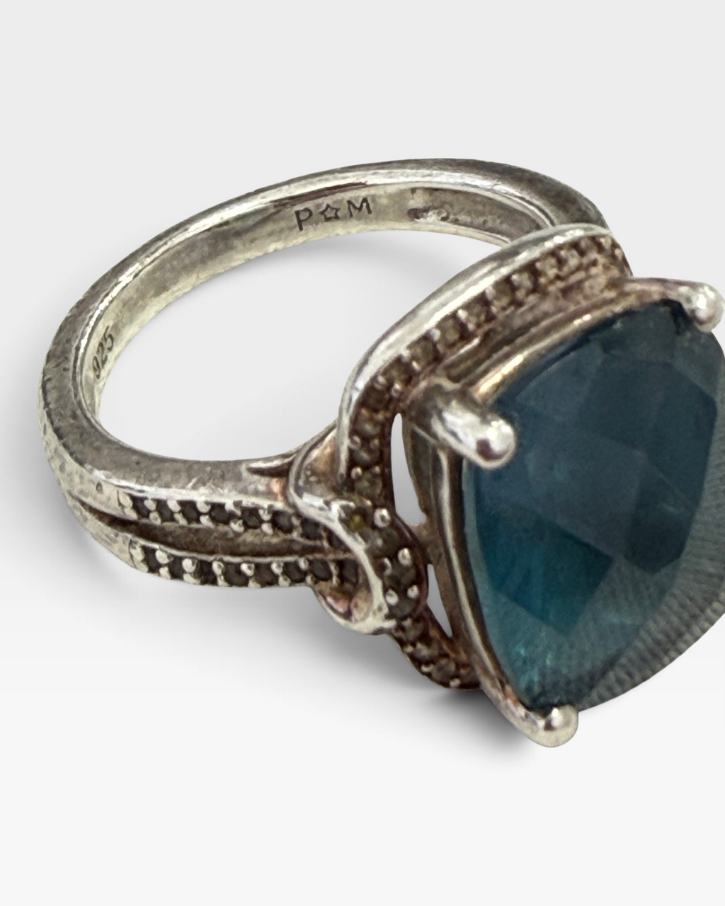 Cavallaro Creations sterling silver statement ring featuring a cushion-cut blue stone and intricate beaded band detail.