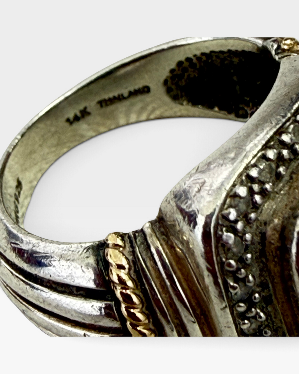 Cavallaro Creations sterling silver ring with 14k gold rope detail and beaded texture, showing interior hallmark