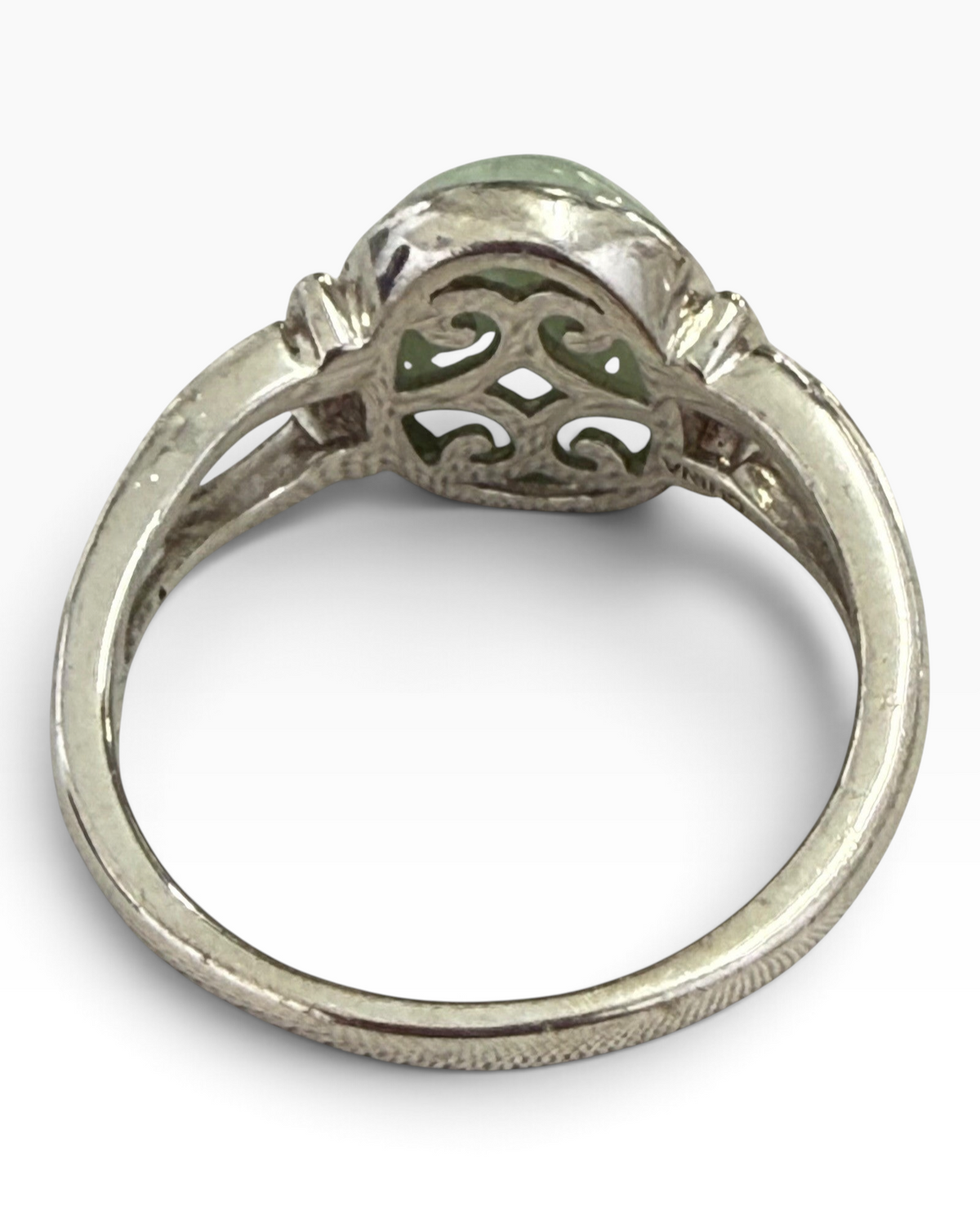 Cavallaro Creations sterling silver ring with an oval pale green cabochon and intricate openwork scroll shoulders.