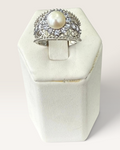 Cavallaro Creations sterling silver pearl ring with a halo of accent stones and intricate filigree band detail.