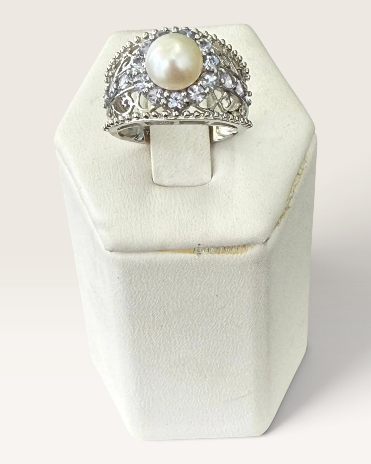 Cavallaro Creations sterling silver pearl ring with a halo of accent stones and intricate filigree band detail.