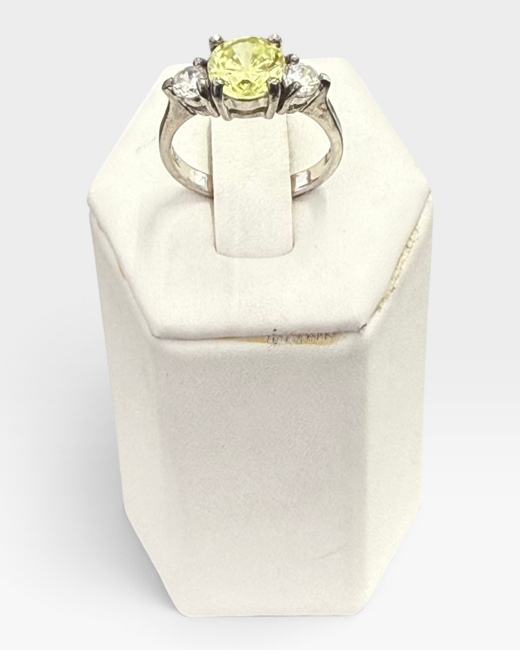 Cavallaro Creations three-stone ring with a yellow center stone and clear side stones on a polished silver-tone band.