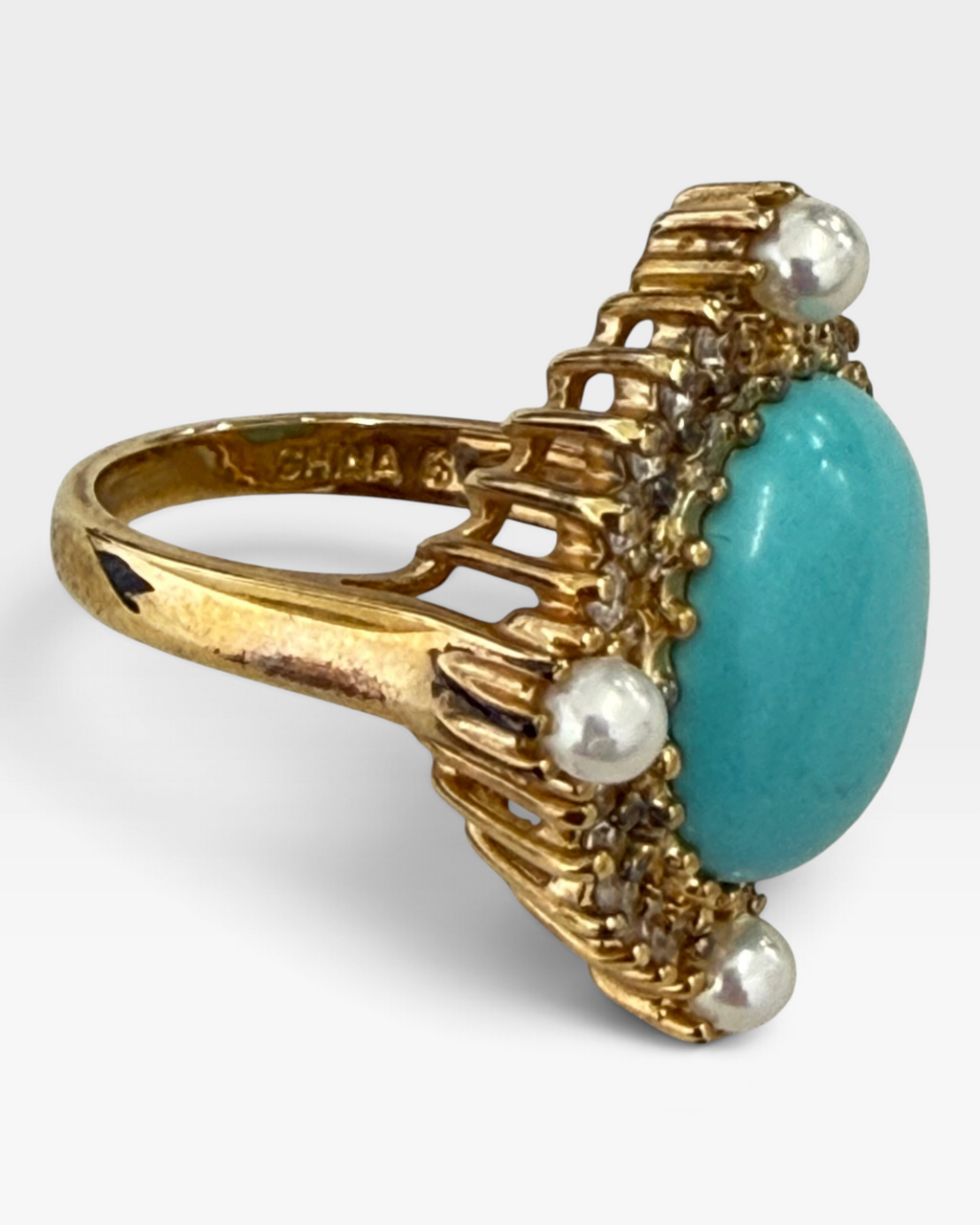 Cavallaro Creations vintage-style gold ring featuring an oval turquoise cabochon, pearl accents, and clear stones.