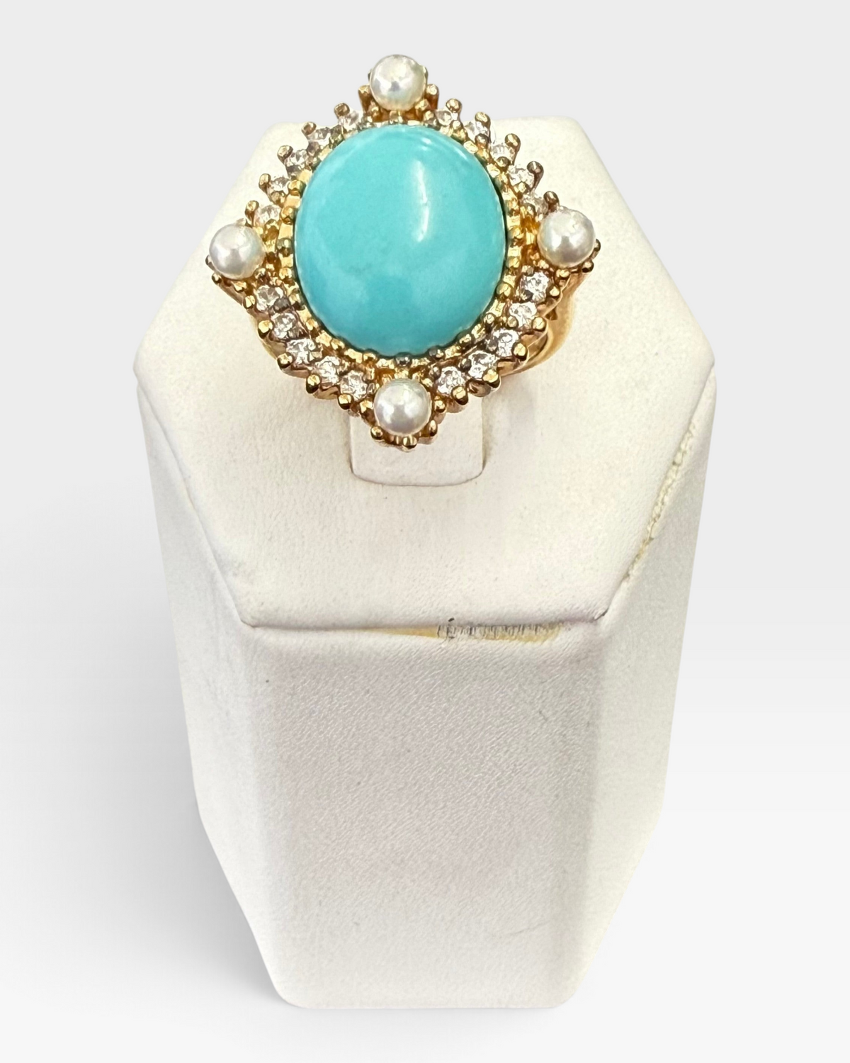 Cavallaro Creations vintage-style gold ring featuring a turquoise cabochon, pearl accents, and sparkling clear stones.