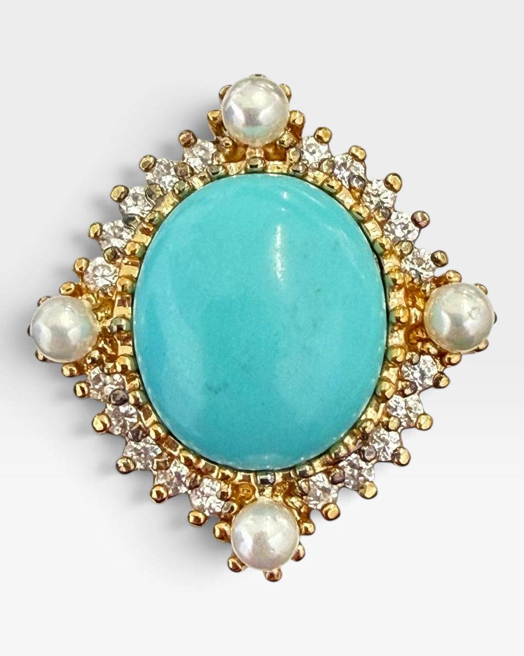 Cavallaro Creations vintage-style statement ring featuring an oval turquoise cabochon, pearls, and clear accent stones.