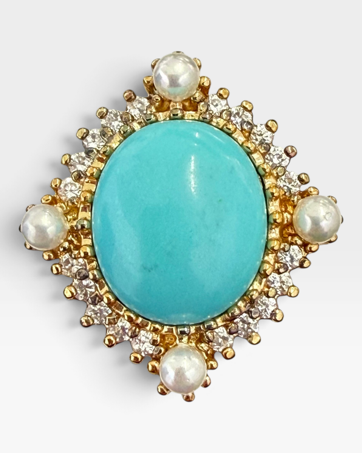 Cavallaro Creations vintage-style statement ring featuring an oval turquoise cabochon, pearls, and clear accent stones.